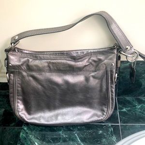 Gently used VINTAGE Coach Motto.